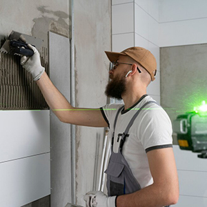 tiler-working-renovation-apartment_23-2149278610